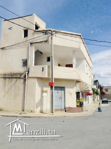 Deux maisons + deux garages de commerce
