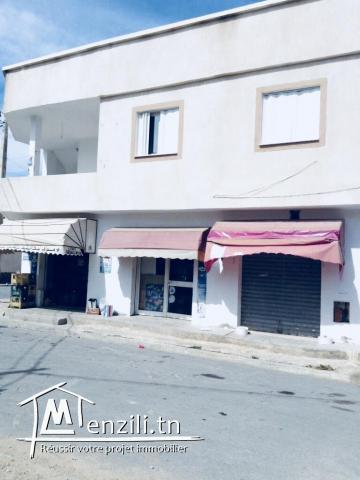 Deux maisons + deux garages de commerce