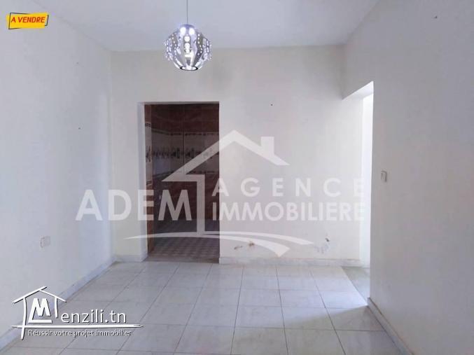 une maison de type S2  sur un lot de coin