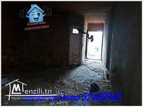 terrain et maison inachevee