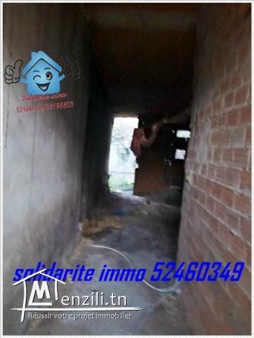 terrain et maison inachevee