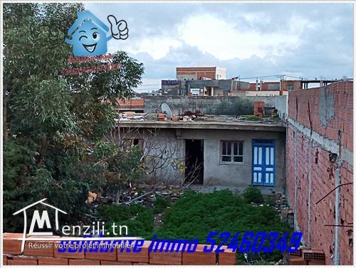 terrain et maison inachevee