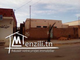 بيع أرض بها 2 منازل وحانوت تاكسيفون وحديقة خلفية