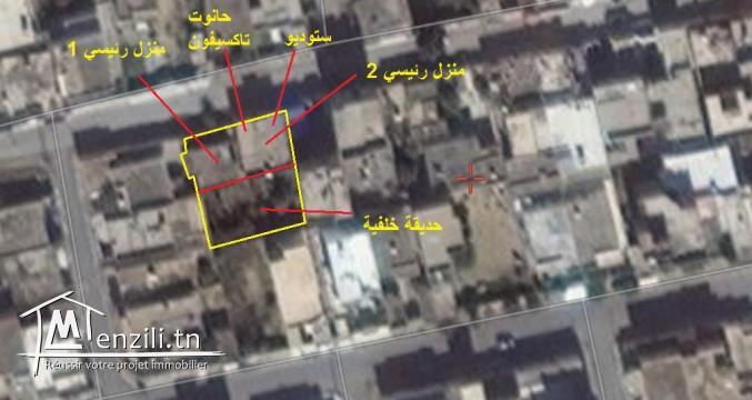 بيع أرض بها 2 منازل وحانوت تاكسيفون وحديقة خلفية