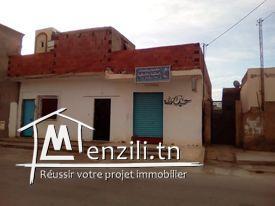 بيع أرض بها 2 منازل وحانوت تاكسيفون وحديقة خلفية