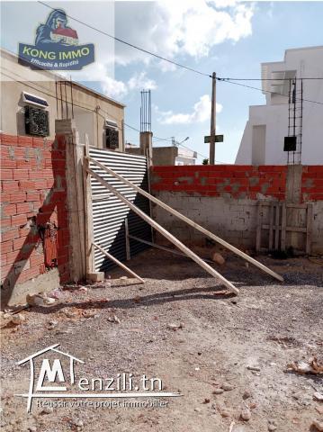 terrain clôturé avec autorisation de bâtir