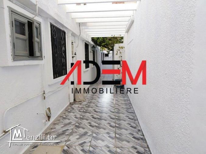 Villa avec deux studios et un local commercial