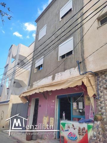 Un petit immeuble + fond de commerce