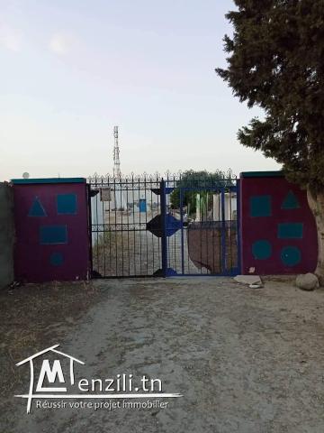 Terrain dont deux maison