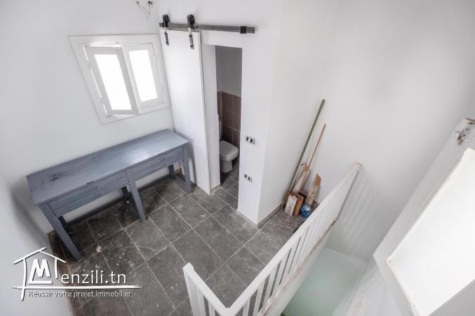 Boutique souk el Berka Tunis, murs et fond de commerce, titre bleu.