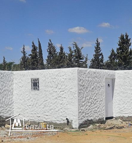 Terrain clôturé à Rmila