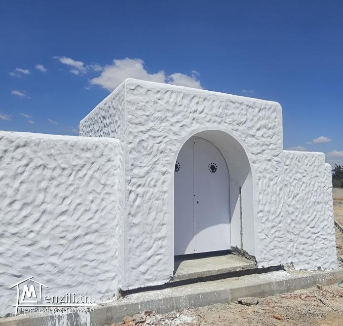 Terrain clôturé à Rmila