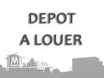 un dépôt couvert et en bon état à louer